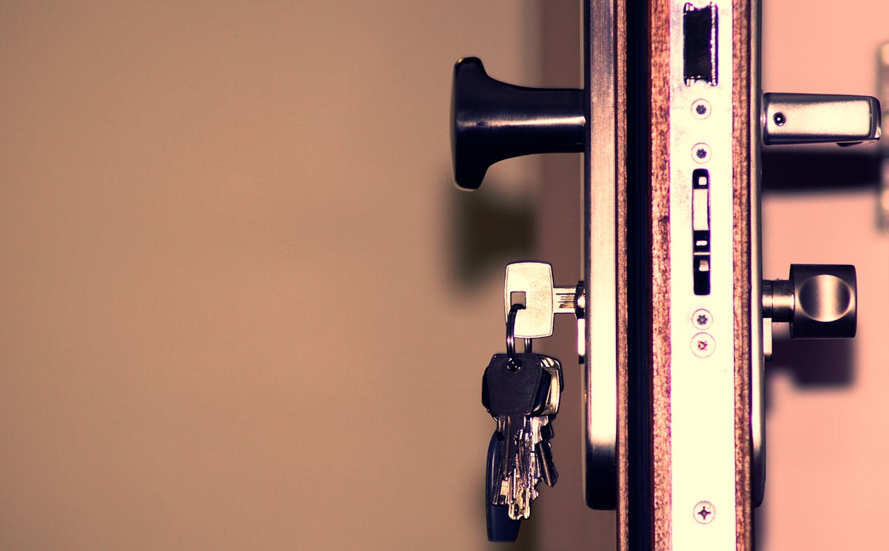 heros-img Detailed view of a door lock and keys emphasizing security and access.